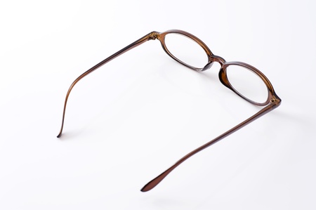 close-up of brown frame eyeglasses on white backgroundの写真素材