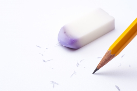 pencil and eraser on white paper backgroundの写真素材