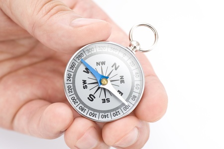 Male hand with a compass, close-up shootの写真素材