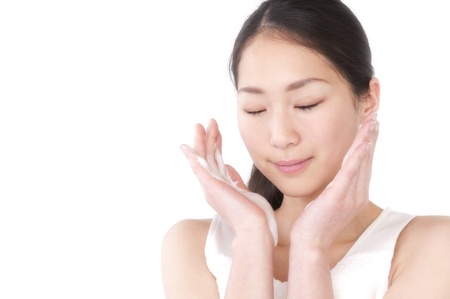Woman wash face with cleanserの写真素材