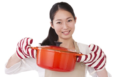 A woman dressed in apron with a potの写真素材