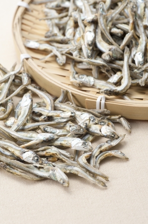 Dried sardine on bamboo basket の写真素材