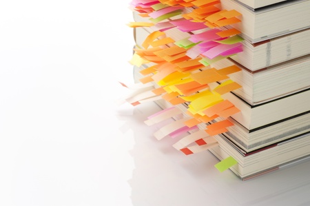 Stack of books with sticky on white background