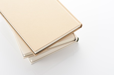 Stacked booksÂ on white background