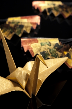 origami crane on black backgroundの写真素材