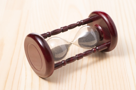 hourglass on wooden tableの写真素材