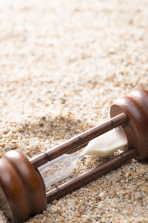 hourglass on sand background