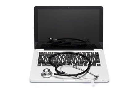 stethoscope on the keyboard of pcの写真素材