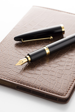 fountain pen on leather notebookの写真素材