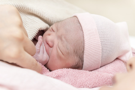 Born newborn baby by motherの写真素材