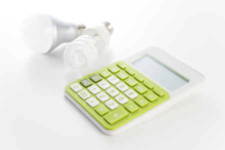 Calculator and LED light bulbの写真素材
