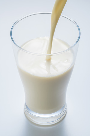 Soymilk is a plant-based drink produced by soybeansの写真素材
