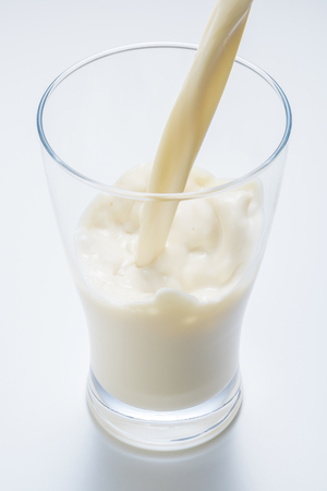 Soymilk is a plant-based drink produced by soybeansの写真素材