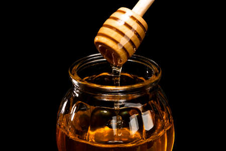 Scoop Honey from the bottleの写真素材