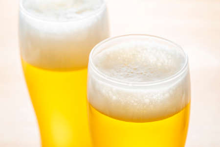 Pour beer into a glassの写真素材