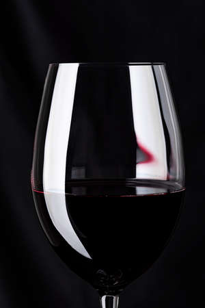 Pour wine in a glassの写真素材