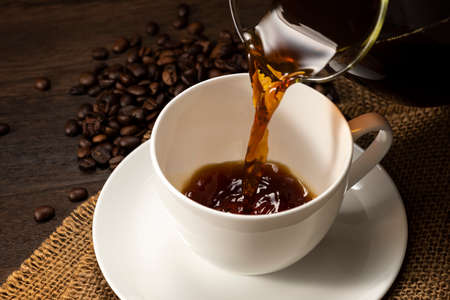 Pouring coffee into a cup