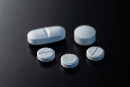Pills medicine on dark backgroundの写真素材