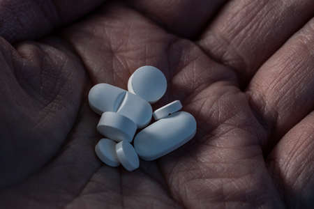 Pills medicine on dark backgroundの写真素材