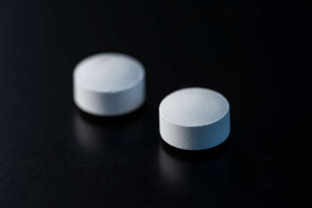 Pills medicine on dark backgroundの写真素材