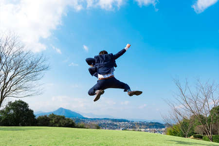 Back view of delighted businessman, outdoorの写真素材