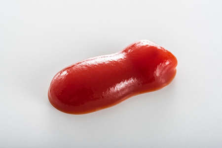 Tomato ketchup line on white backgroundの写真素材