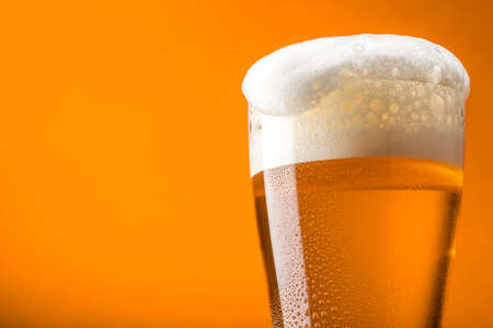 Pour beer into a beer mugの写真素材