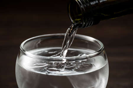 Pour sake into the sake glass.