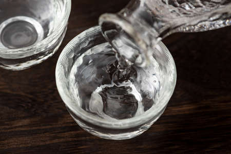 Pour sake into choko