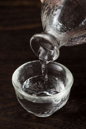 Pour sake into choko