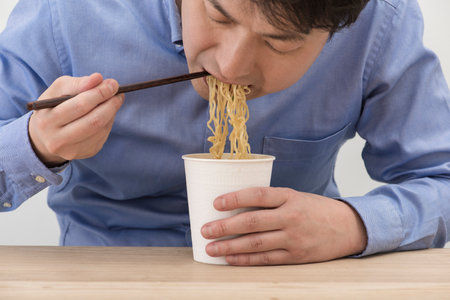 Pour hot water and eat cup noodles.の写真素材