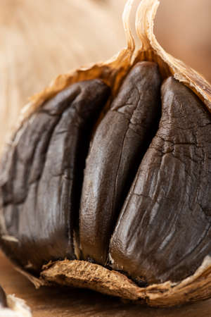 Black garlic, health food made by fermenting garlic.の写真素材