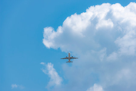 Airliner taking off in the blue sky.の写真素材