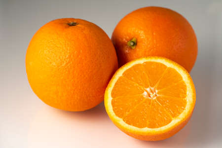 Cut orange citrus on white background