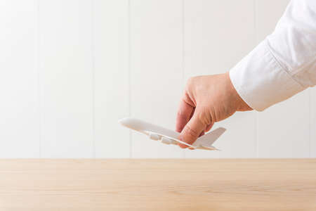 On the wooden desk is the runway of the model airplane.