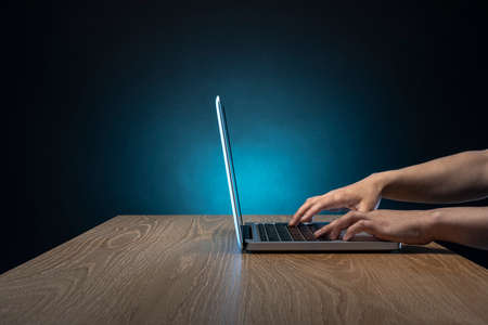 Open the laptop with male hands.の写真素材