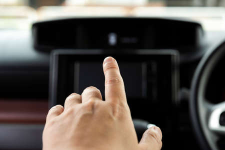 Operate the car navigation systemの写真素材