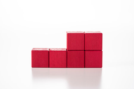 Stack red wooden blocks. white background.