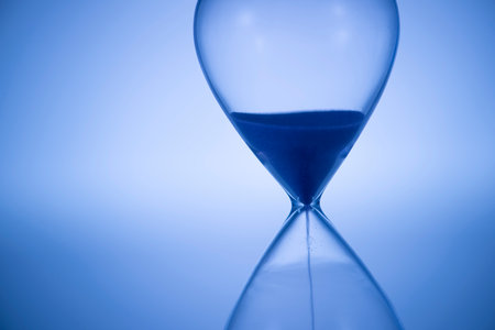 Retro glass hourglass close up.の写真素材