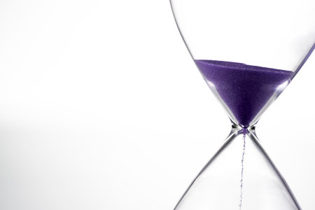 Retro glass hourglass close up.の写真素材