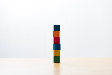 Blocks stacked on wood table.