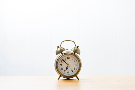 Alarm clock on wood table.の写真素材