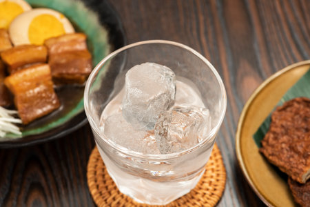 Cuisine and drinks in Japanese bar restaurant. Shochu on the rock.の写真素材