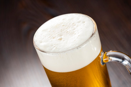 Draft beer on a dark wood tableの写真素材