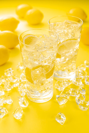 Highball Laced With Lemon juice Flavour.
Yellow background.の写真素材