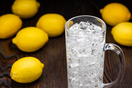 Highball Laced With Lemon juice Flavour. Wood grain background.の写真素材