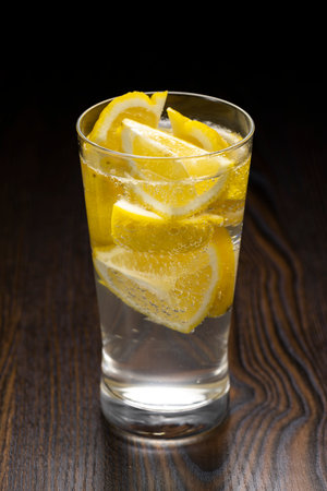 Highball Laced With Lemon juice Flavour. Wood grain background.の写真素材