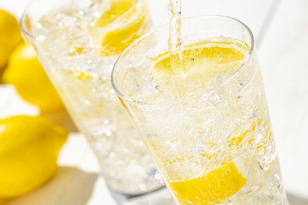 Highball Laced With Lemon juice Flavour.
Fresh white plank background.の写真素材