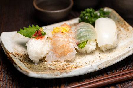 Sushi and sake bottle on the tableの写真素材