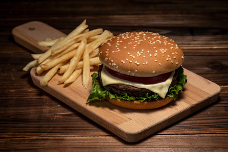<p>Hamburger and french fries on the table</p>の写真素材